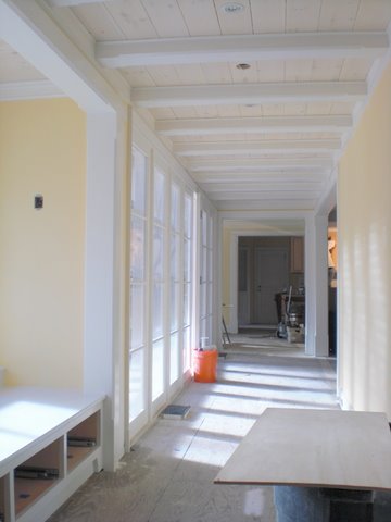 added glazed loggia at window seat connecting originally exterior bedrooms