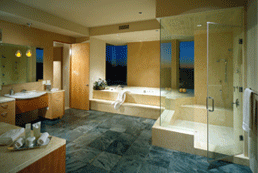 A spacious bath in Scottsdale (Fairway I) offers a cool escape for a professional athlete. An adjacent exercise room connects to the pool outside. 