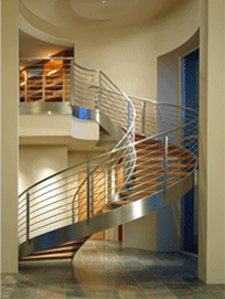 In a Scottsdale (Fairway I) house whose view is behind arriving guests (out the front door) an interior view was created with components like this stainless steel stair, and an adjacent dining room and pool, to be an eye-catching initial impression.